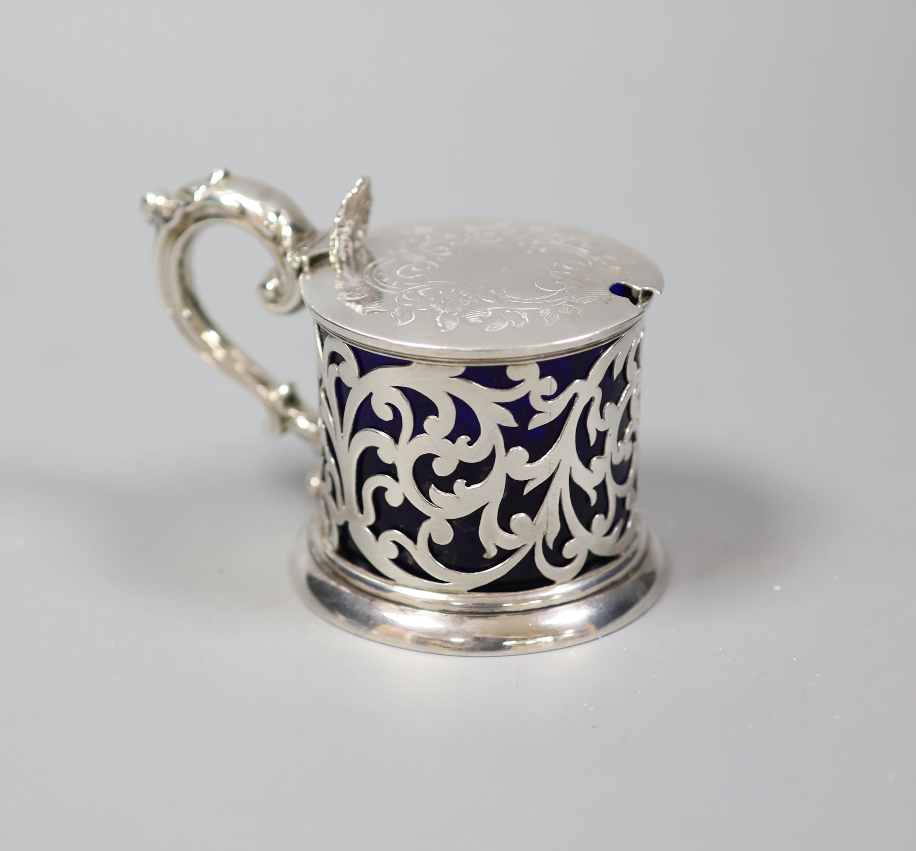 A Victorian pierced silver mustard, with blue glass liner, London, 1846, 75mm.